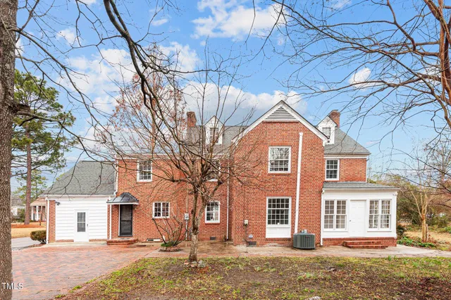 a view of a swimming pool with a yard
