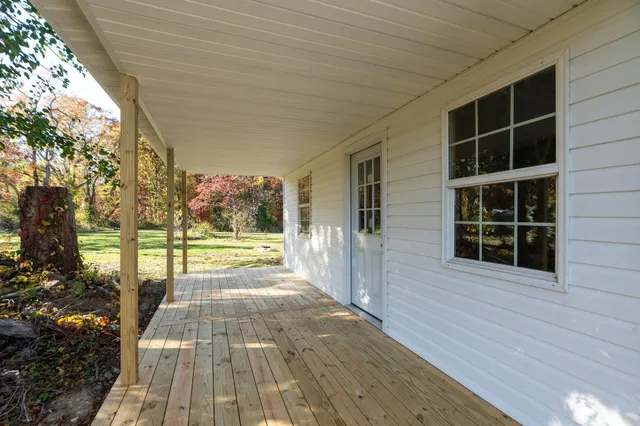 a view of a room with window and wooden floor