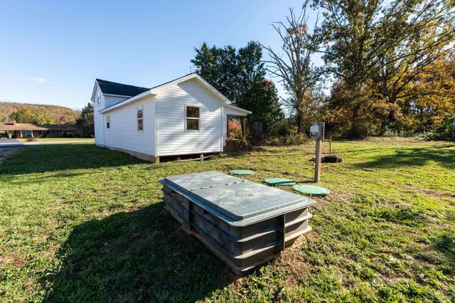 a view of a park with large trees
