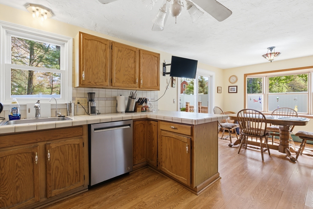 19 Mockingbird Lane Maynard, MA 01754 - Photo 8 of 34 a kitchen with a sink cabinets and wooden floor