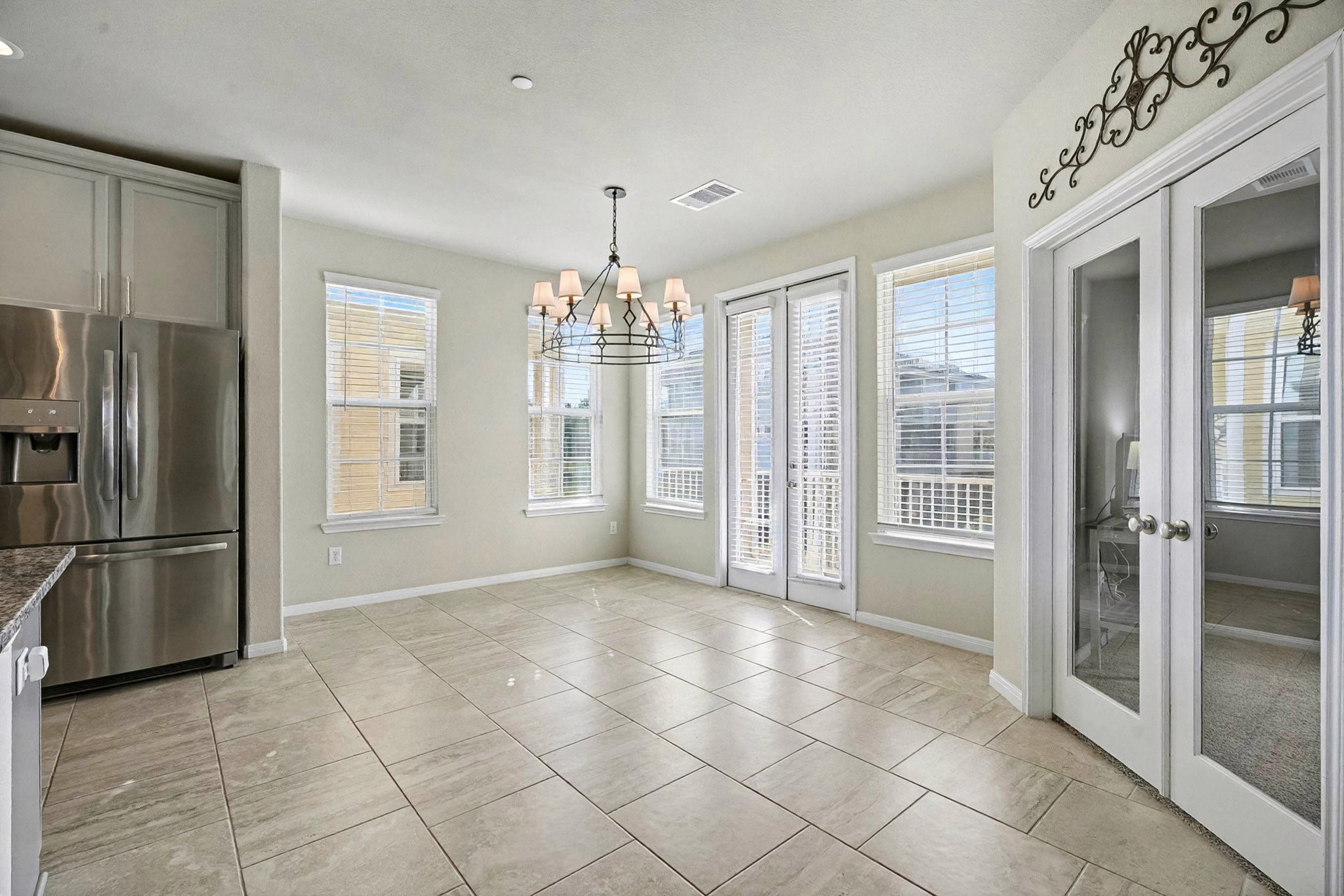 1412 Veranda Mist League City, TX 77573 - Photo 15 of 35 a view of a kitchen with a refrigerator and a sink
