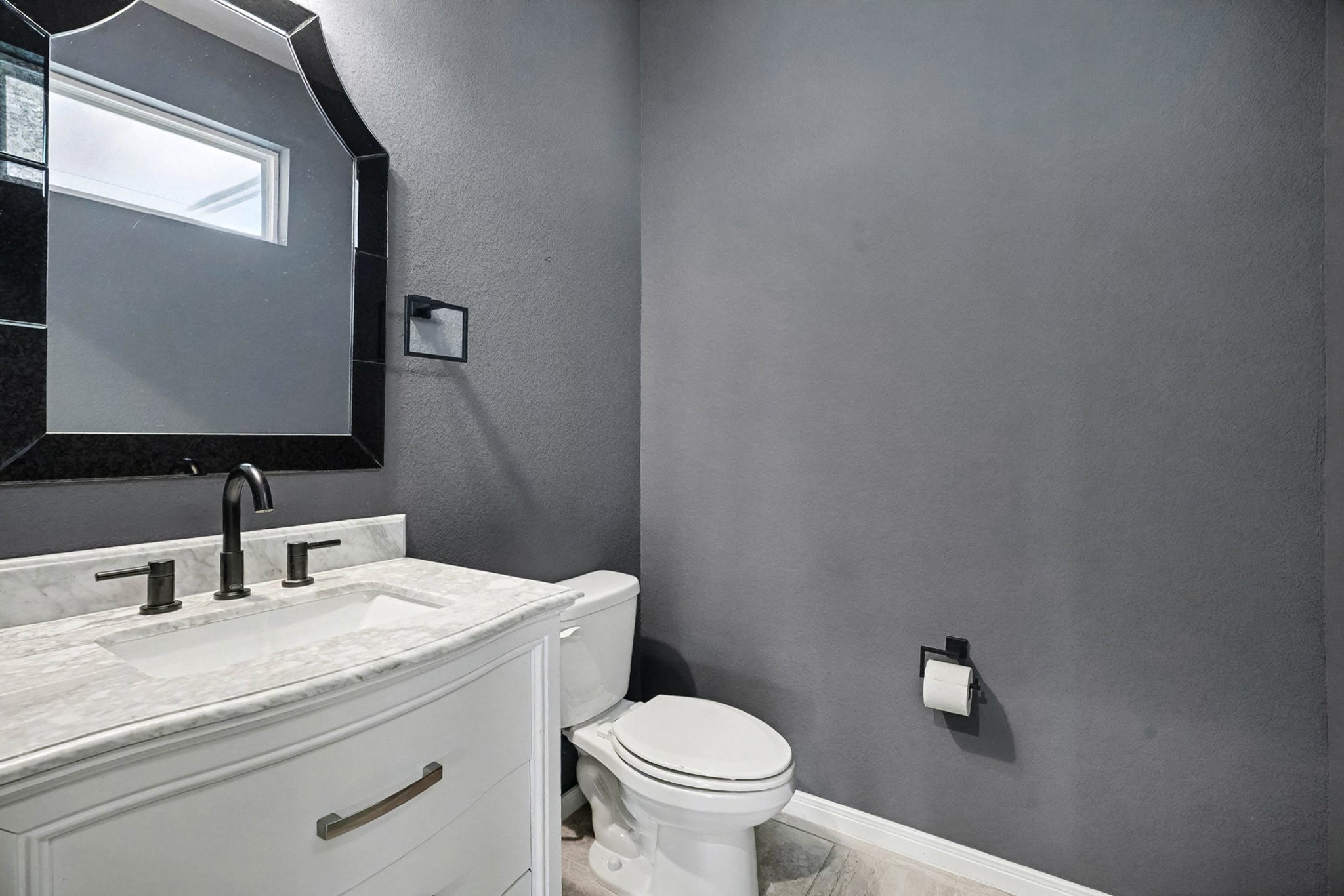 1412 Veranda Mist League City, TX 77573 - Photo 16 of 35 a bathroom with a toilet sink and mirror