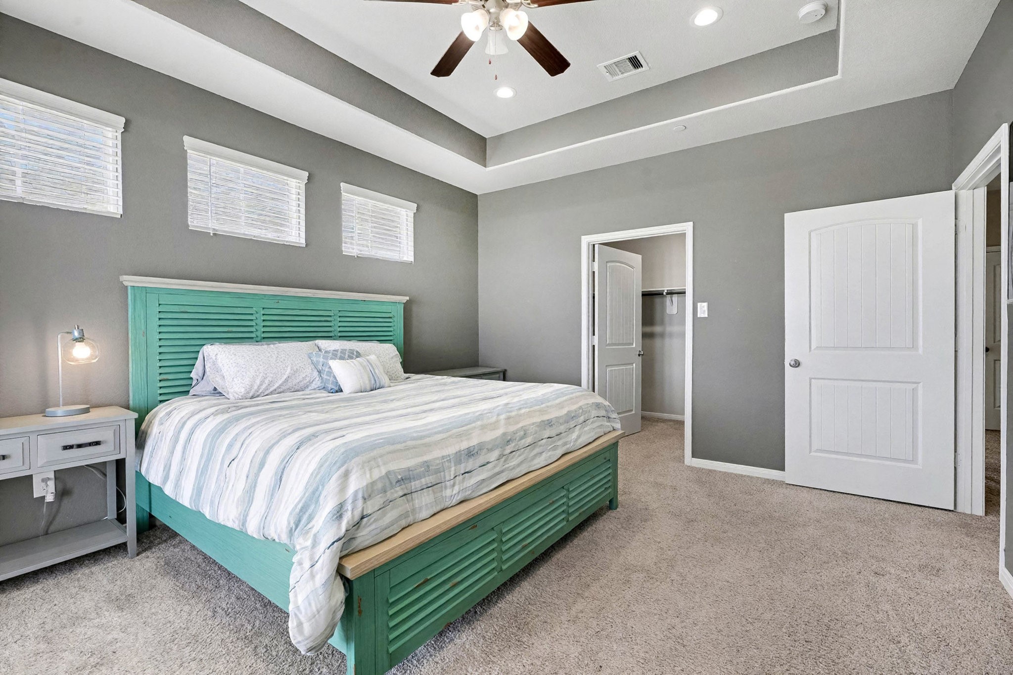 1412 Veranda Mist League City, TX 77573 - Photo 21 of 35 a spacious bedroom with a bed and a ceiling fan