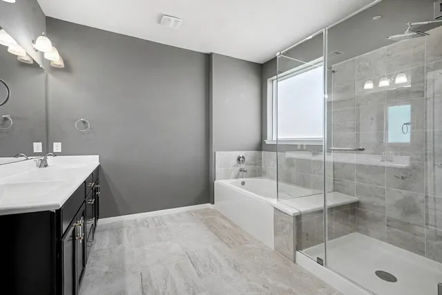 a bathroom with a sink and a shower