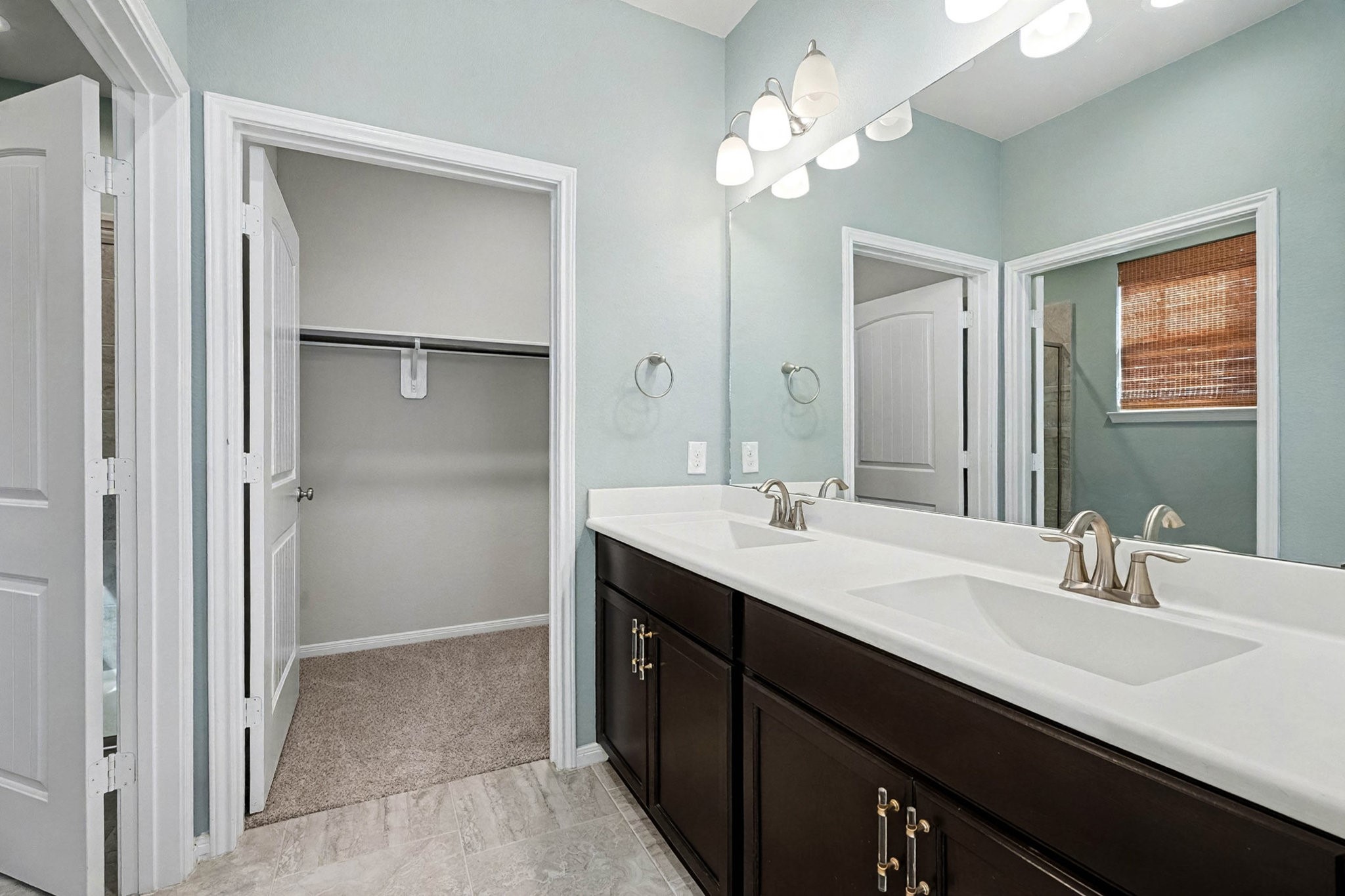 1412 Veranda Mist League City, TX 77573 - Photo 26 of 35 a bathroom with a double vanity sink mirror and shower