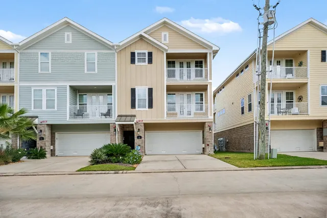 a kitchen with granite countertop a refrigerator oven a sink dishwasher and a dining table with wooden floor