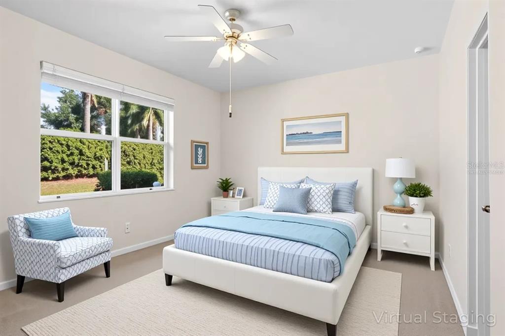 16252 Amethyst Key Drive Wimauma, FL 33598 - Photo 20 of 47 a bedroom with a bed couch and a window