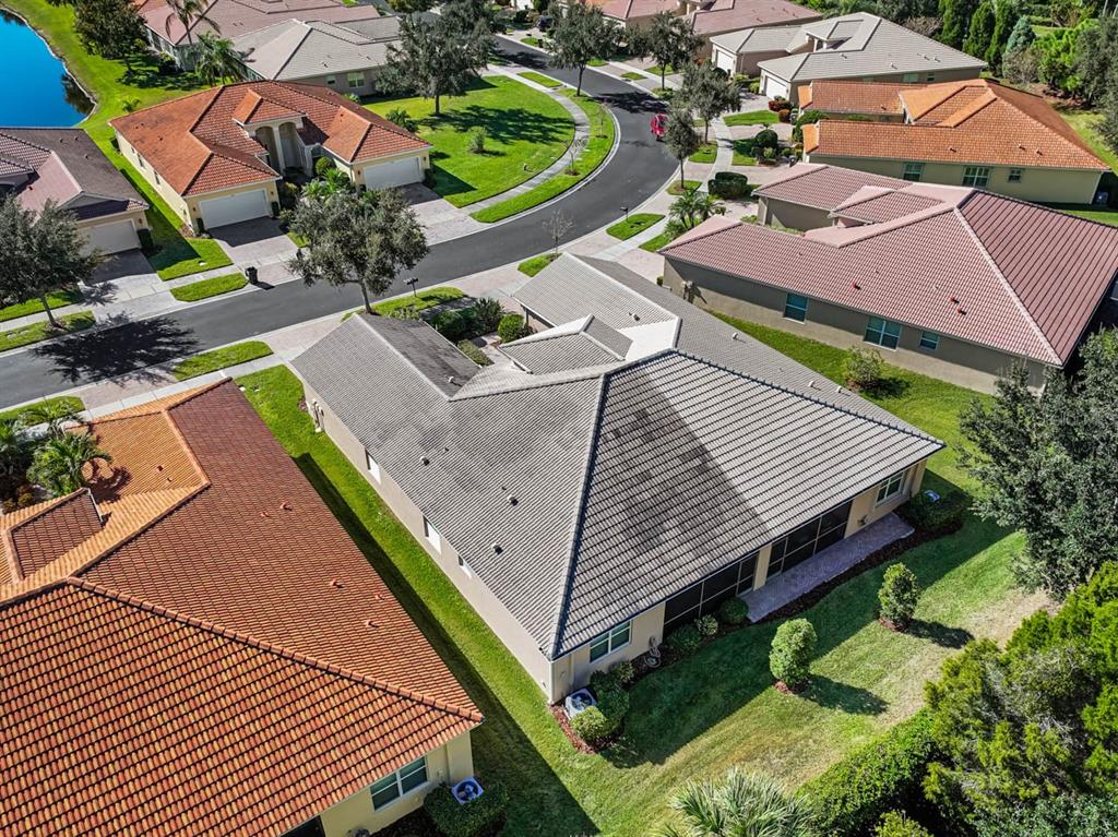 16252 Amethyst Key Drive Wimauma, FL 33598 - Photo 34 of 47 an aerial view of a house with a garden and outdoor seating
