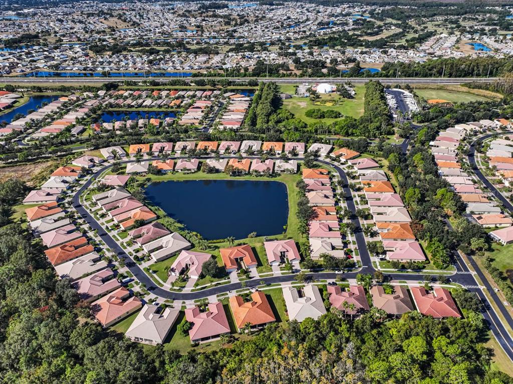 16252 Amethyst Key Drive Wimauma, FL 33598 - Photo 37 of 47 an aerial view of swimming pool patio and outdoor seating