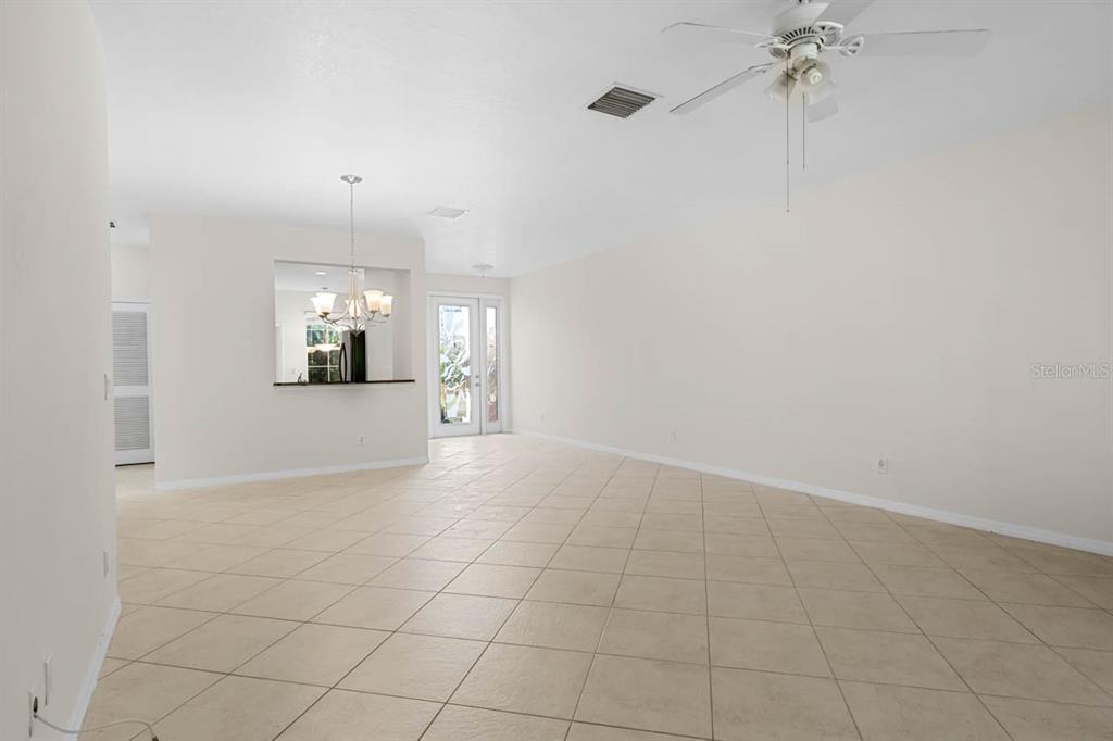 16252 Amethyst Key Drive Wimauma, FL 33598 - Photo 9 of 47 an empty room with a empty space and windows
