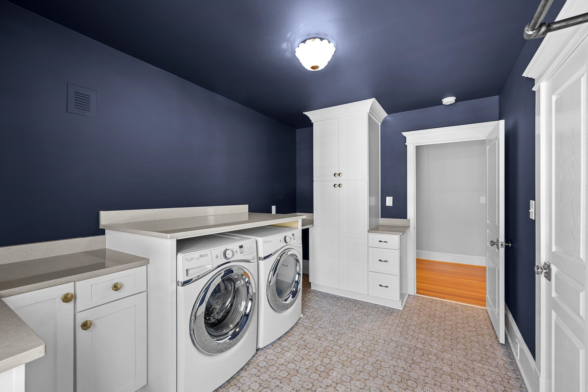 2116 Cowper Drive Raleigh, NC 27608 - Photo 55 of 65 This room has been outfitted with a tile floor, linen closet, extra cabinets and built-in racks. Oversize Laundry Room