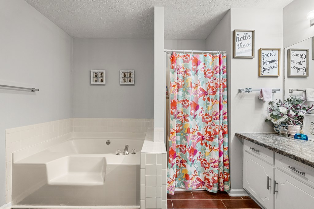 4420 Hudson Mill Road Cataula, GA 31804 - Photo 17 of 25 a bathroom with a bathtub and shower