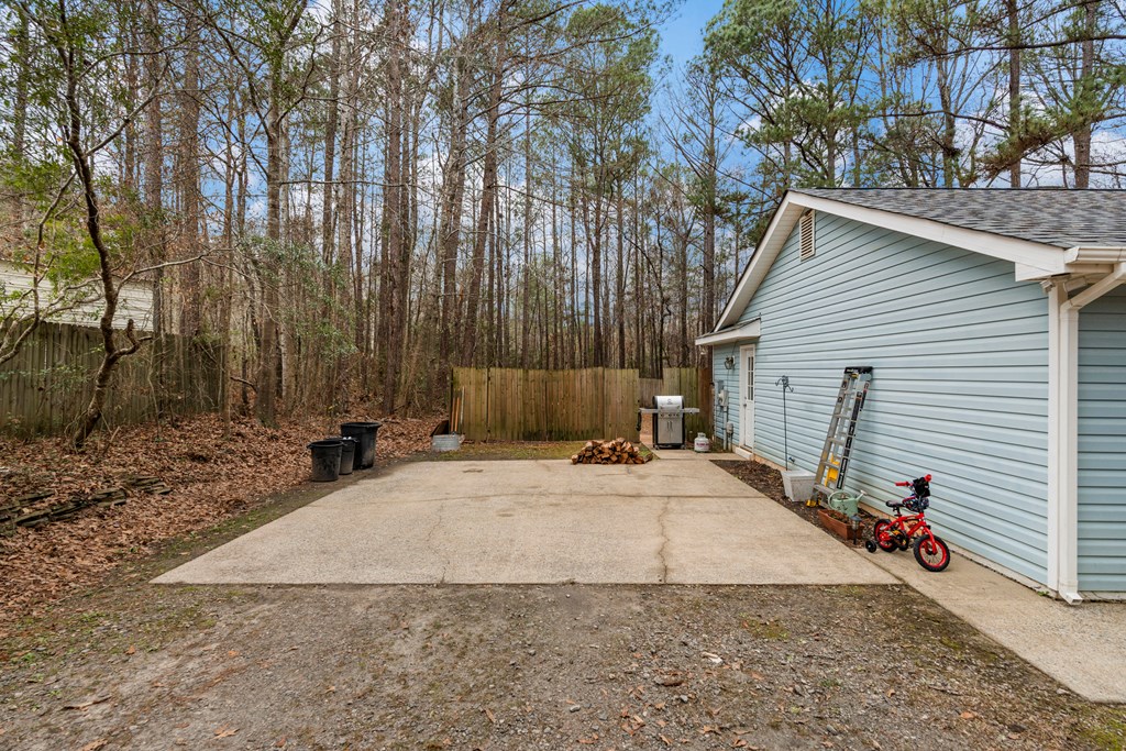 4420 Hudson Mill Road Cataula, GA 31804 - Photo 23 of 25 a view of a backyard with a tree