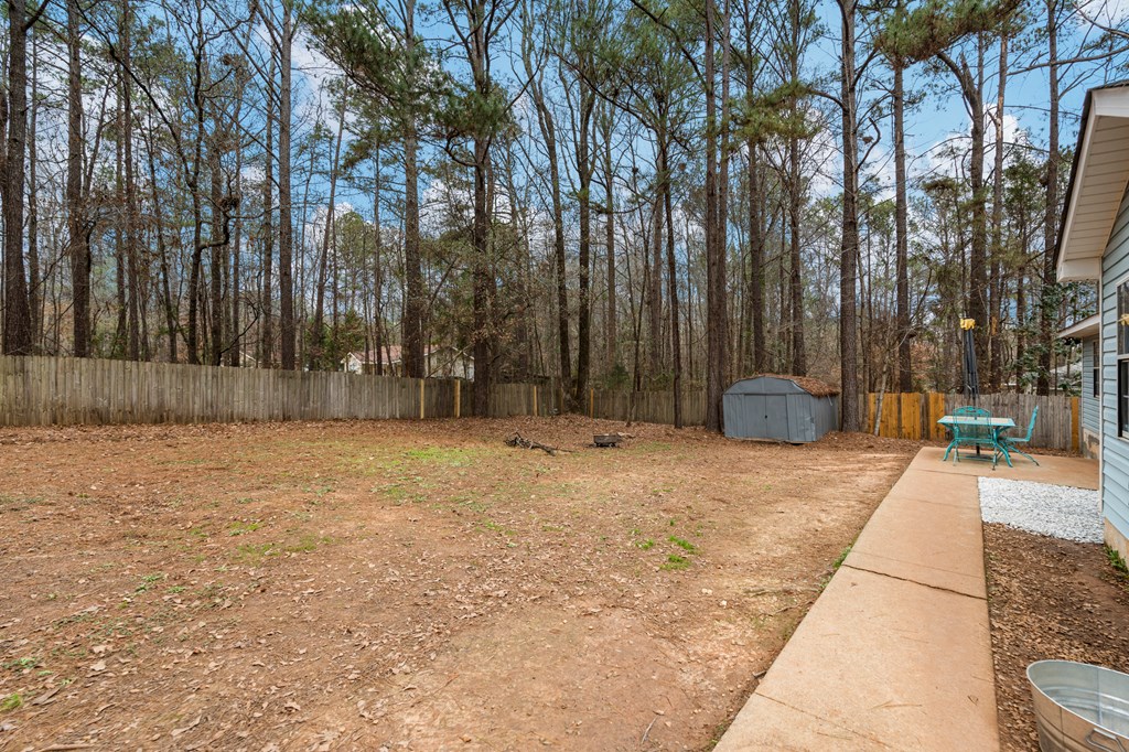 4420 Hudson Mill Road Cataula, GA 31804 - Photo 24 of 25 a backyard of a house with lots of green space