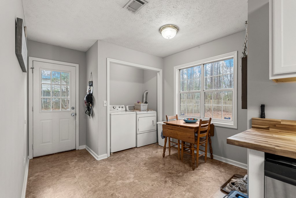 4420 Hudson Mill Road Cataula, GA 31804 - Photo 7 of 25 a room with a desk and chairs