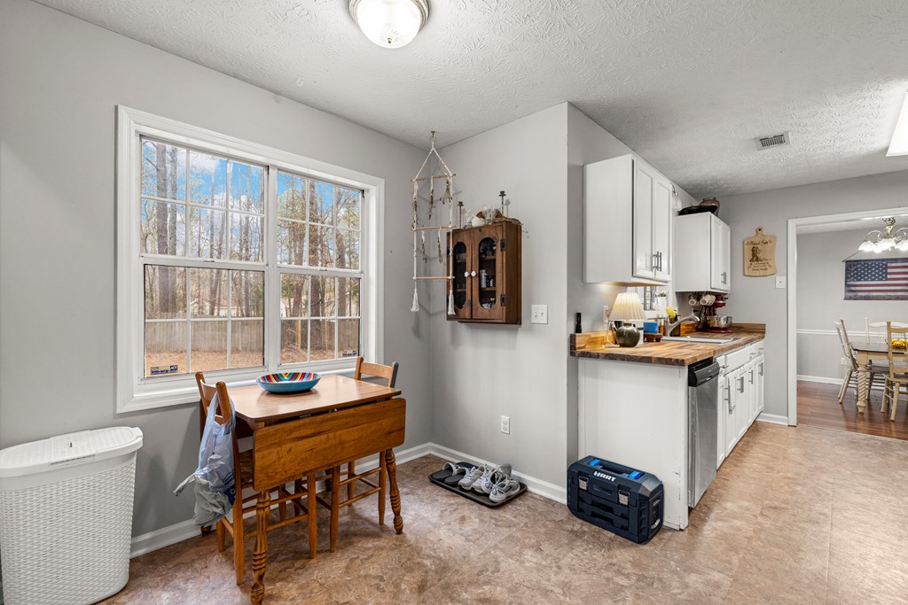 4420 Hudson Mill Road Cataula, GA 31804 - Photo 8 of 25 a kitchen with sink cabinets and outdoor view