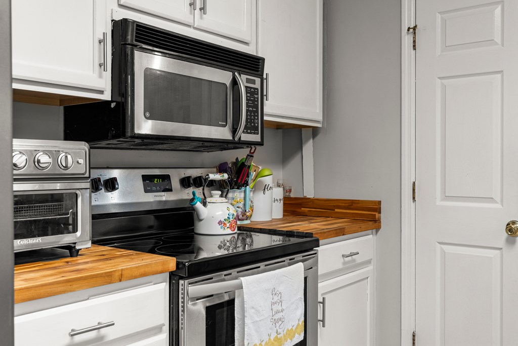 4420 Hudson Mill Road Cataula, GA 31804 - Photo 10 of 25 a kitchen with a stove and a microwave