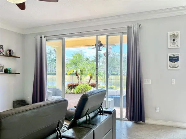 a view of a livingroom with workspace and a window