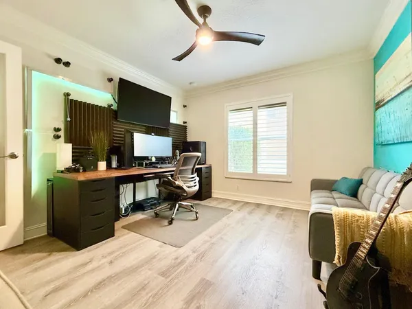 a spacious bathroom with a tub sink and mirror