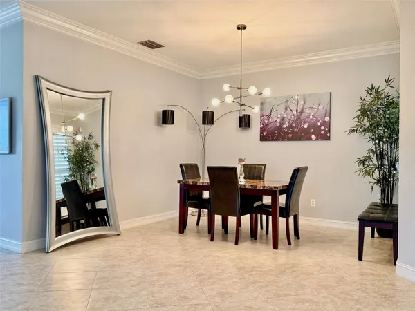 a view of a livingroom with furniture and a flat screen tv