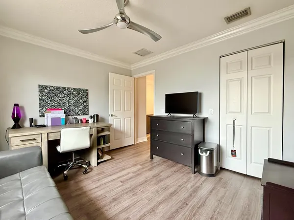 a front view of a building with garden