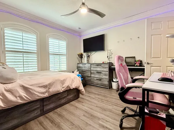 a swimming pool with outdoor seating and yard