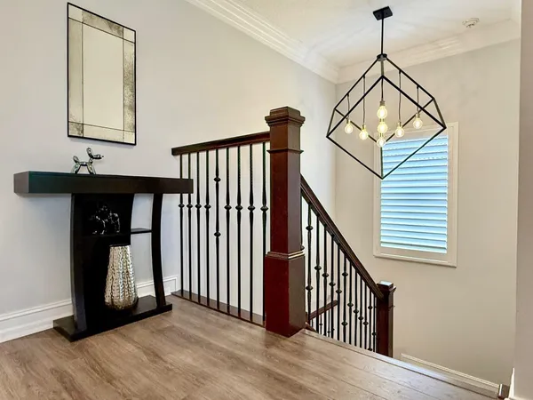 an aerial view of residential houses with outdoor space and lake view