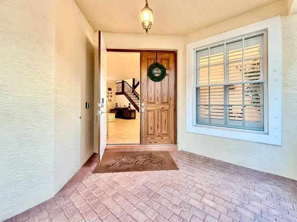 a view of a livingroom with furniture and a chandelier
