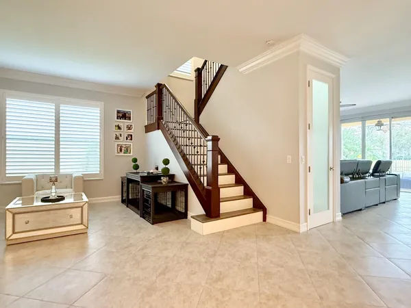 a living room with furniture and windows