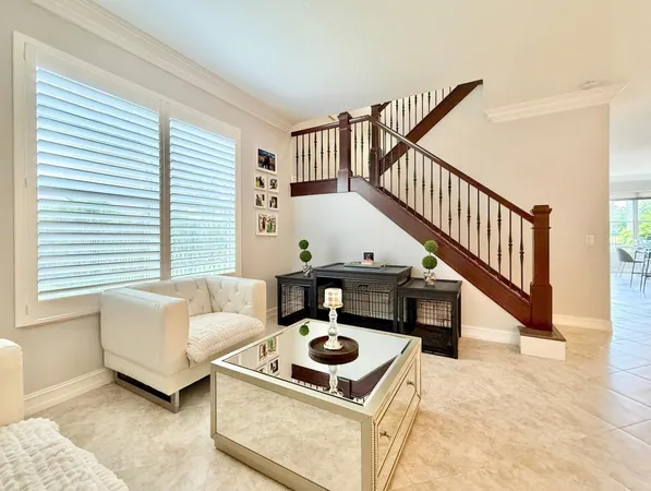 a kitchen with kitchen island granite countertop wooden cabinets and stainless steel appliances