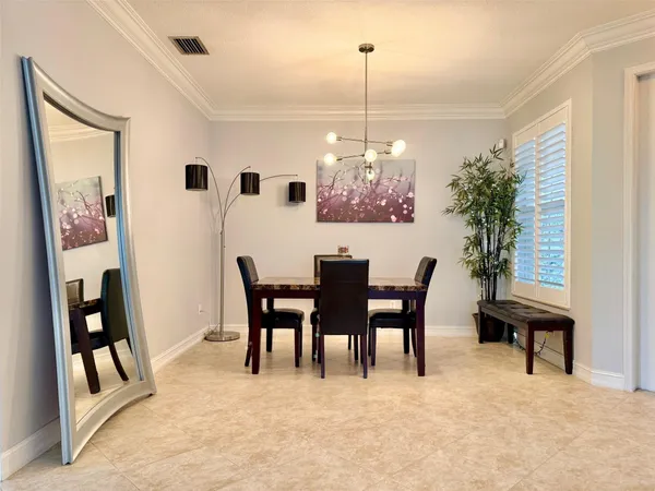 a kitchen with stainless steel appliances granite countertop a stove refrigerator and cabinets