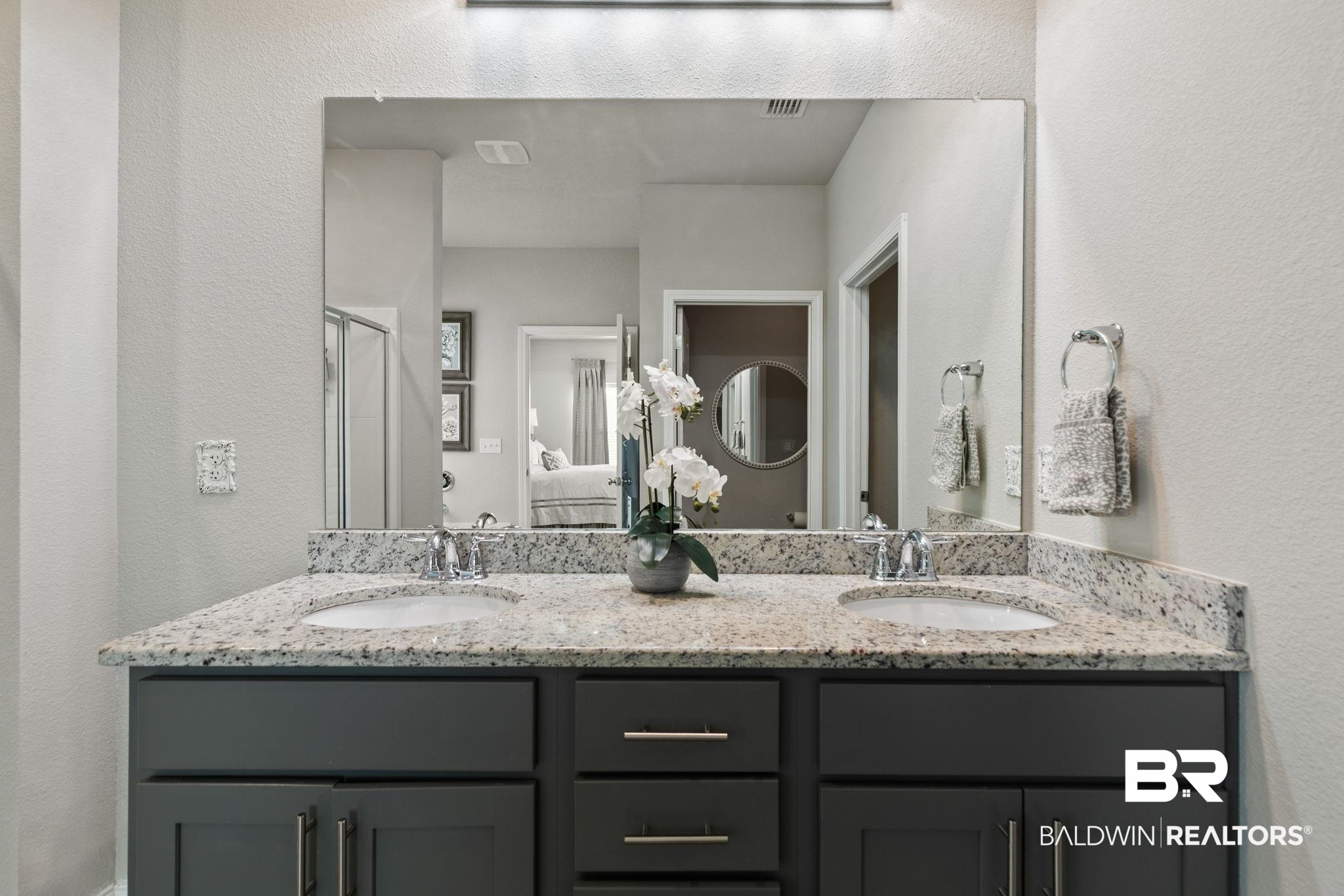 31650 Memphis Loop Daphne, AL 36527 - Photo 27 of 68 Bathroom featuring a textured wall, double vanity, and a stall shower