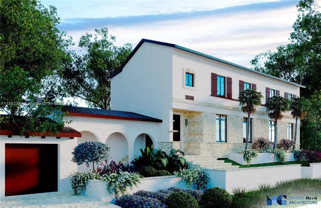 a front view of a house with lots of trees around