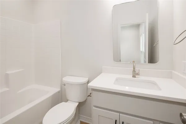 a bathroom with a sink toilet and bathtub