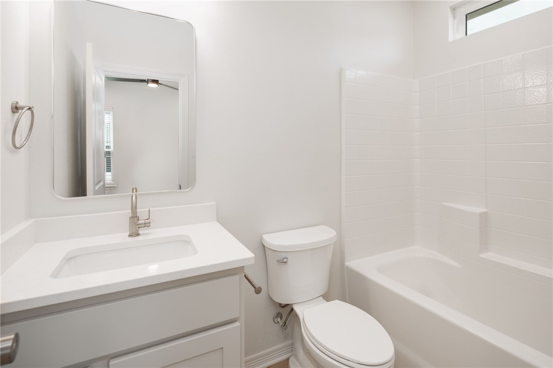 412 Ash Street College Station, TX 77840 - Photo 16 of 21 a bathroom with a sink toilet and shower