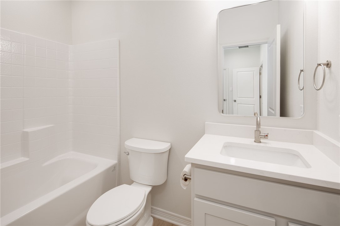412 Ash Street College Station, TX 77840 - Photo 18 of 21 a bathroom with a sink toilet and shower