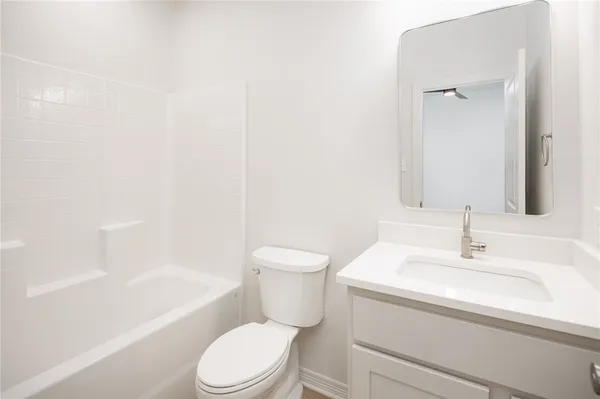 a bathroom with a sink a toilet and a bathtub