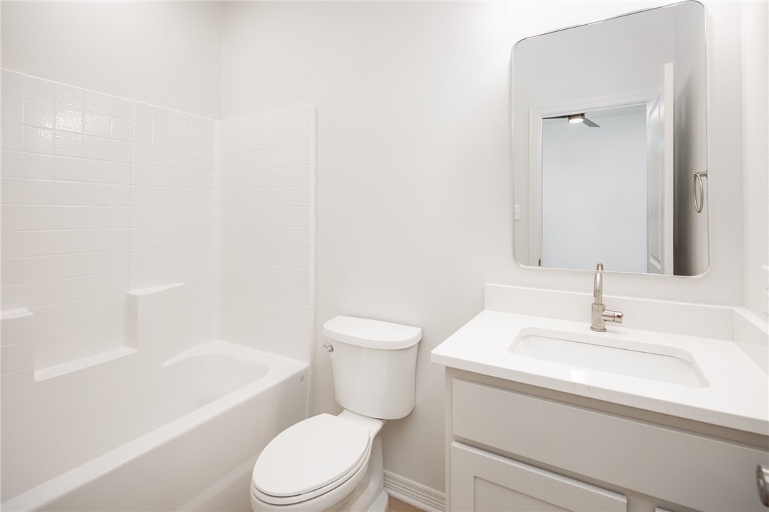 412 Ash Street College Station, TX 77840 - Photo 20 of 21 a bathroom with a sink a toilet and a bathtub