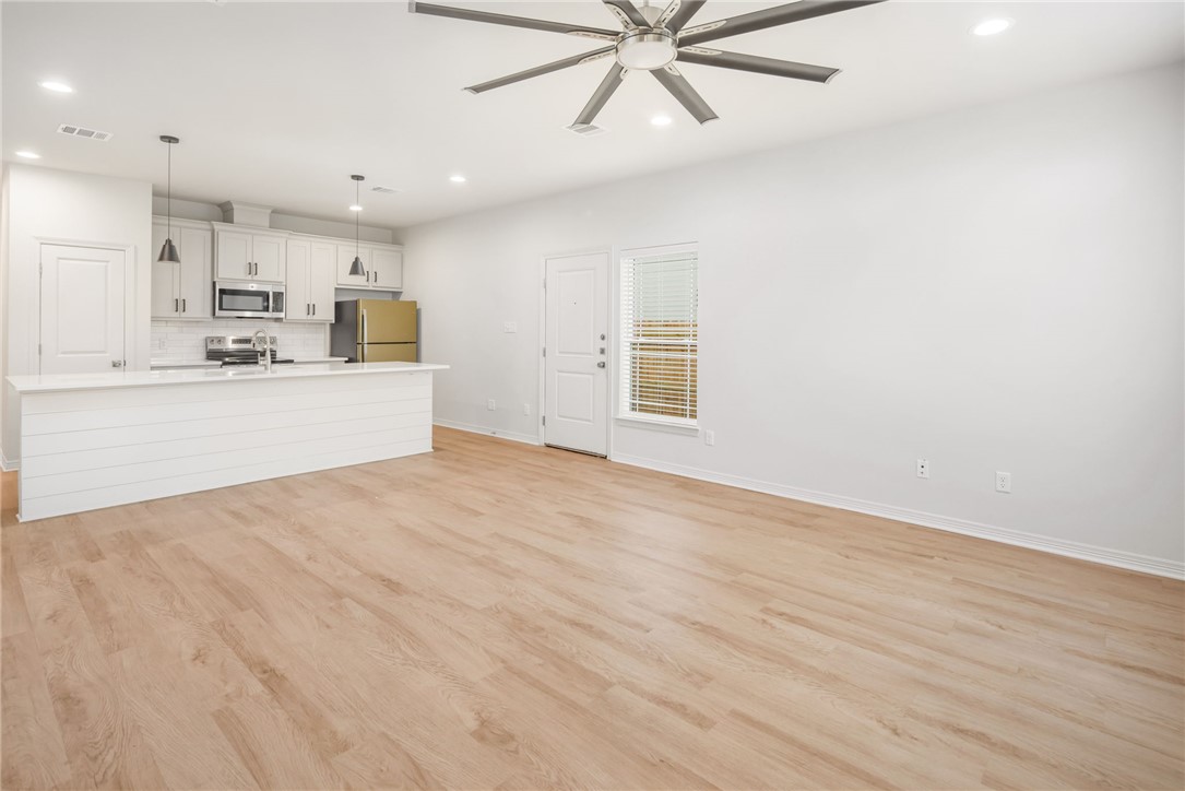 412 Ash Street College Station, TX 77840 - Photo 5 of 21 a view of a kitchen with microwave and cabinets