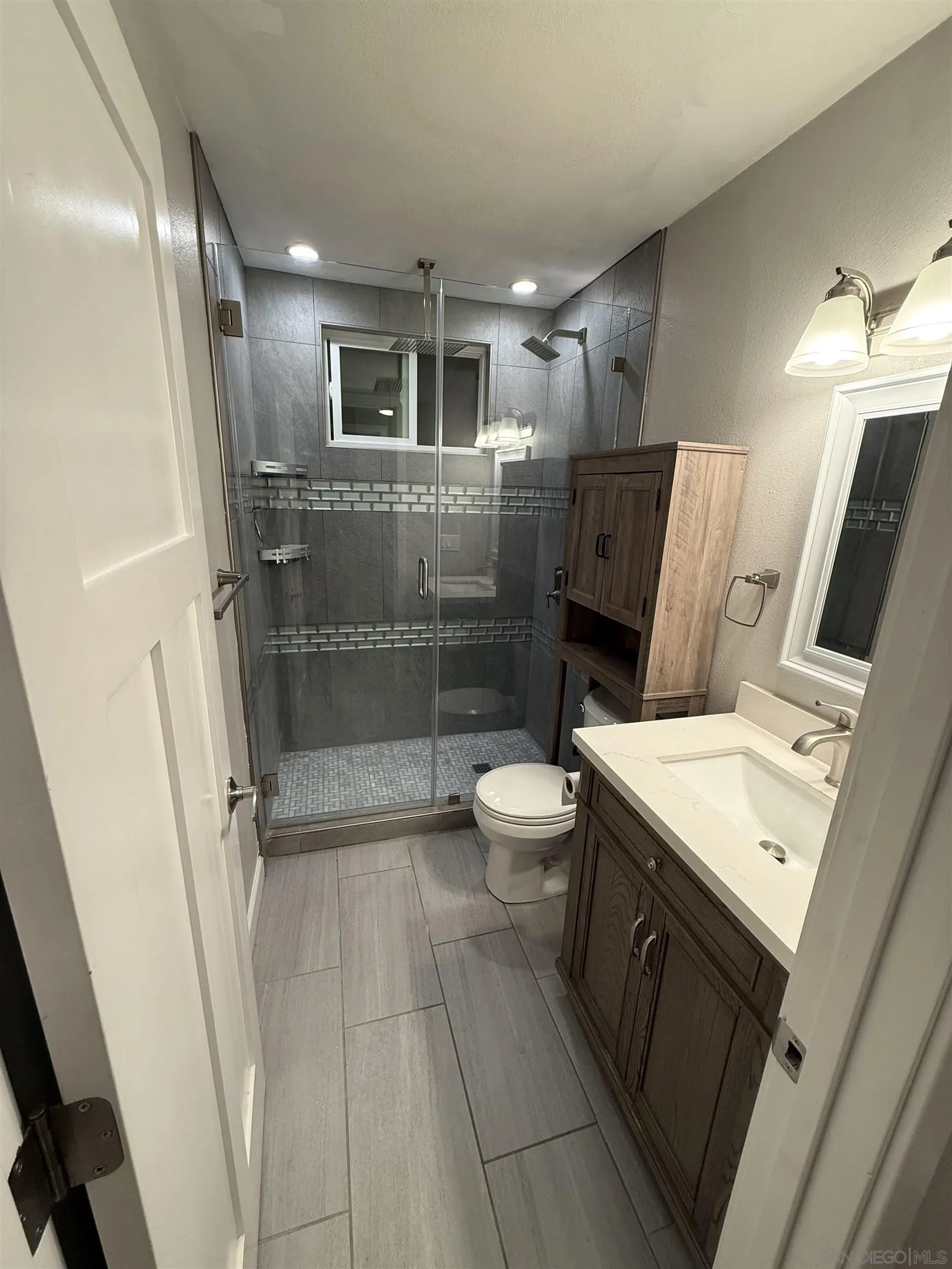 2520 Wanek Road, Unit B Escondido, CA 92027 - Photo 7 of 12 a bathroom with a sink a toilet and shower