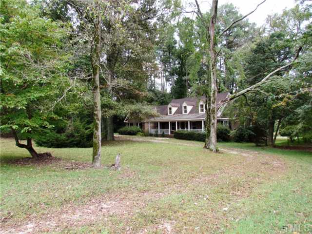 5000 Holly Ridge Farm Road Raleigh, NC 27616 - Photo 2 of 25 a view of a house with a backyard