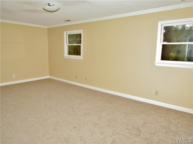 5000 Holly Ridge Farm Road Raleigh, NC 27616 - Photo 12 of 25 an empty room with a window