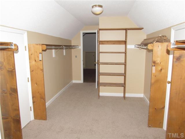 5000 Holly Ridge Farm Road Raleigh, NC 27616 - Photo 13 of 25 a view of closet area with empty racks