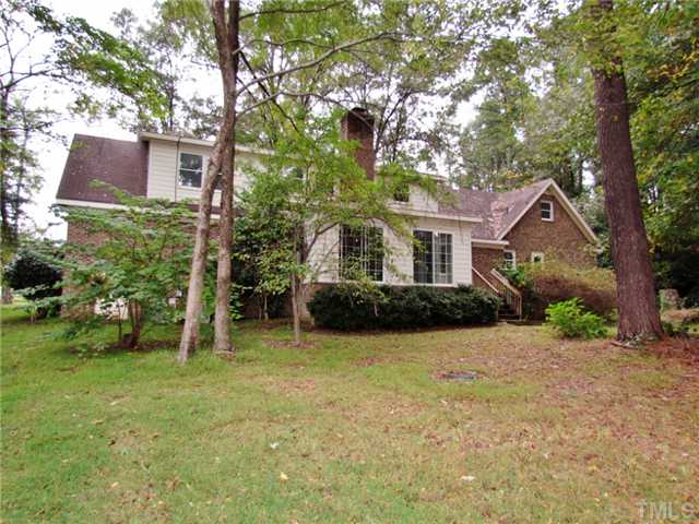 5000 Holly Ridge Farm Road Raleigh, NC 27616 - Photo 16 of 25 a front view of a house with a yard