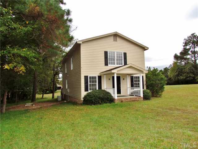 5000 Holly Ridge Farm Road Raleigh, NC 27616 - Photo 18 of 25 a front view of a house with a yard