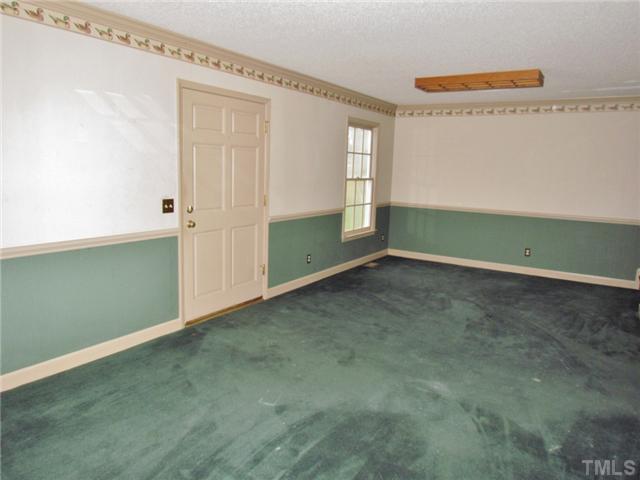 5000 Holly Ridge Farm Road Raleigh, NC 27616 - Photo 20 of 25 a view of room with window and ceiling fan