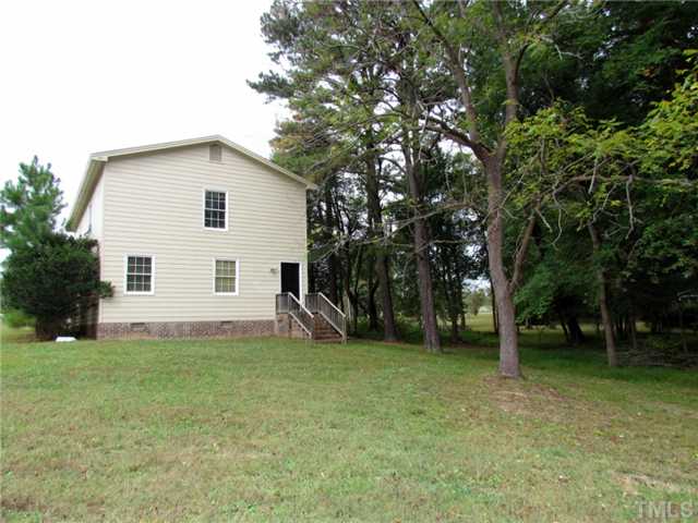 5000 Holly Ridge Farm Road Raleigh, NC 27616 - Photo 25 of 25 a view of a house with a yard