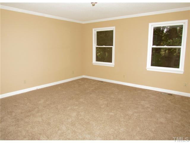 5000 Holly Ridge Farm Road Raleigh, NC 27616 - Photo 10 of 25 a view of an empty room with a window