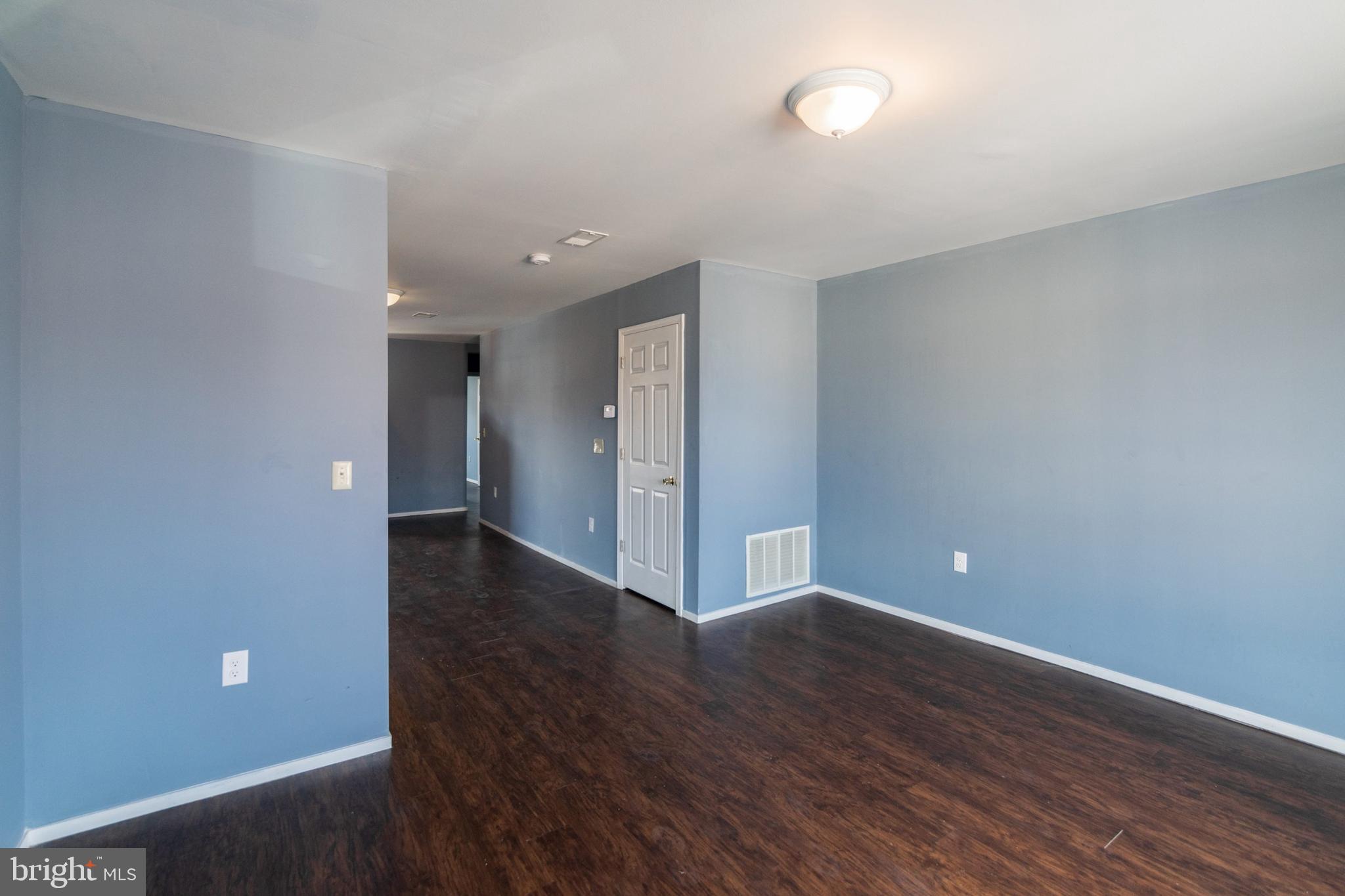 1833 South 22nd Street, Unit 2 Philadelphia, PA 19145 - Photo 4 of 15 a view of an empty room with wooden floor