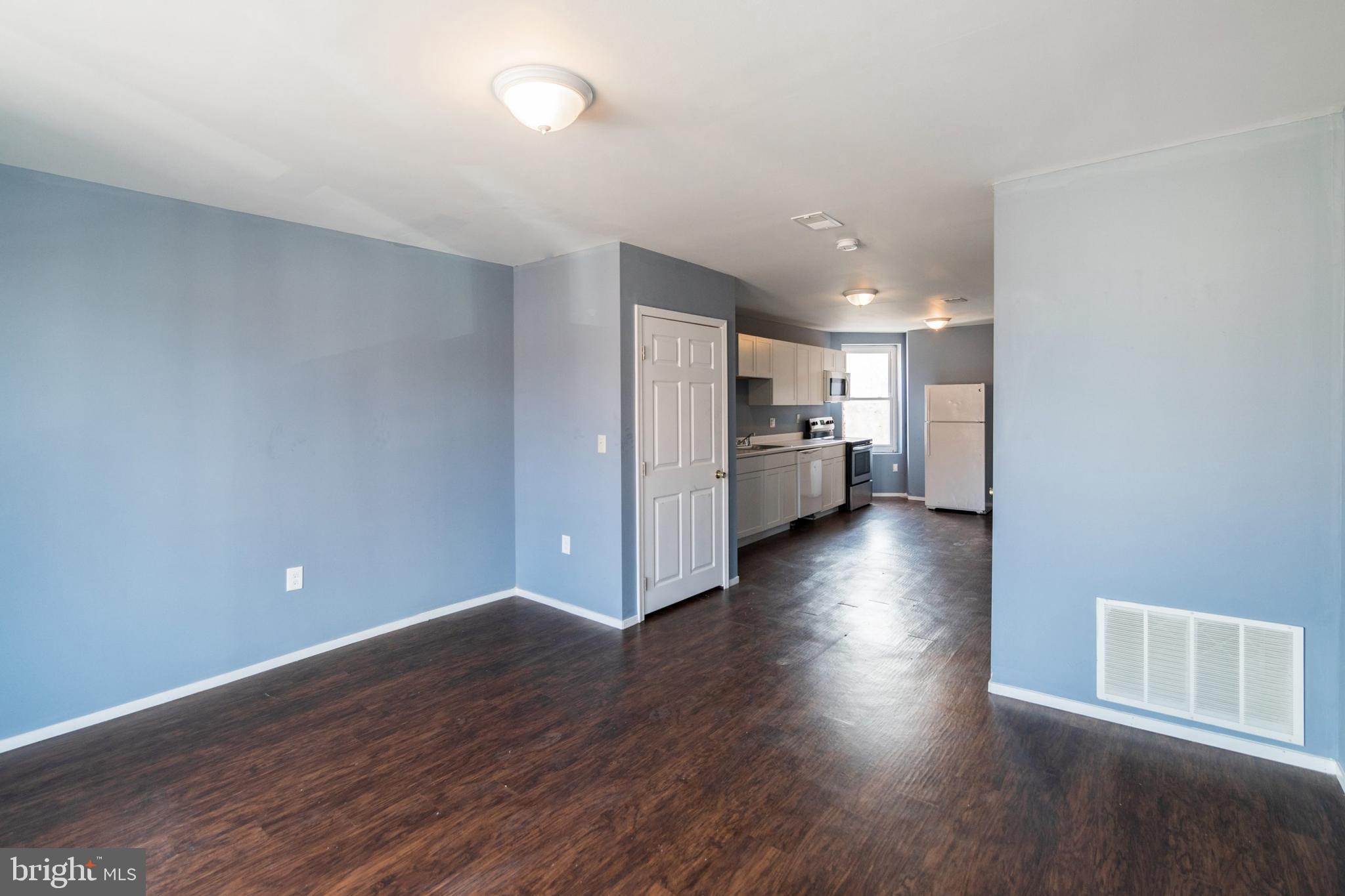 1833 South 22nd Street, Unit 2 Philadelphia, PA 19145 - Photo 5 of 15 a view of empty room with wooden floor